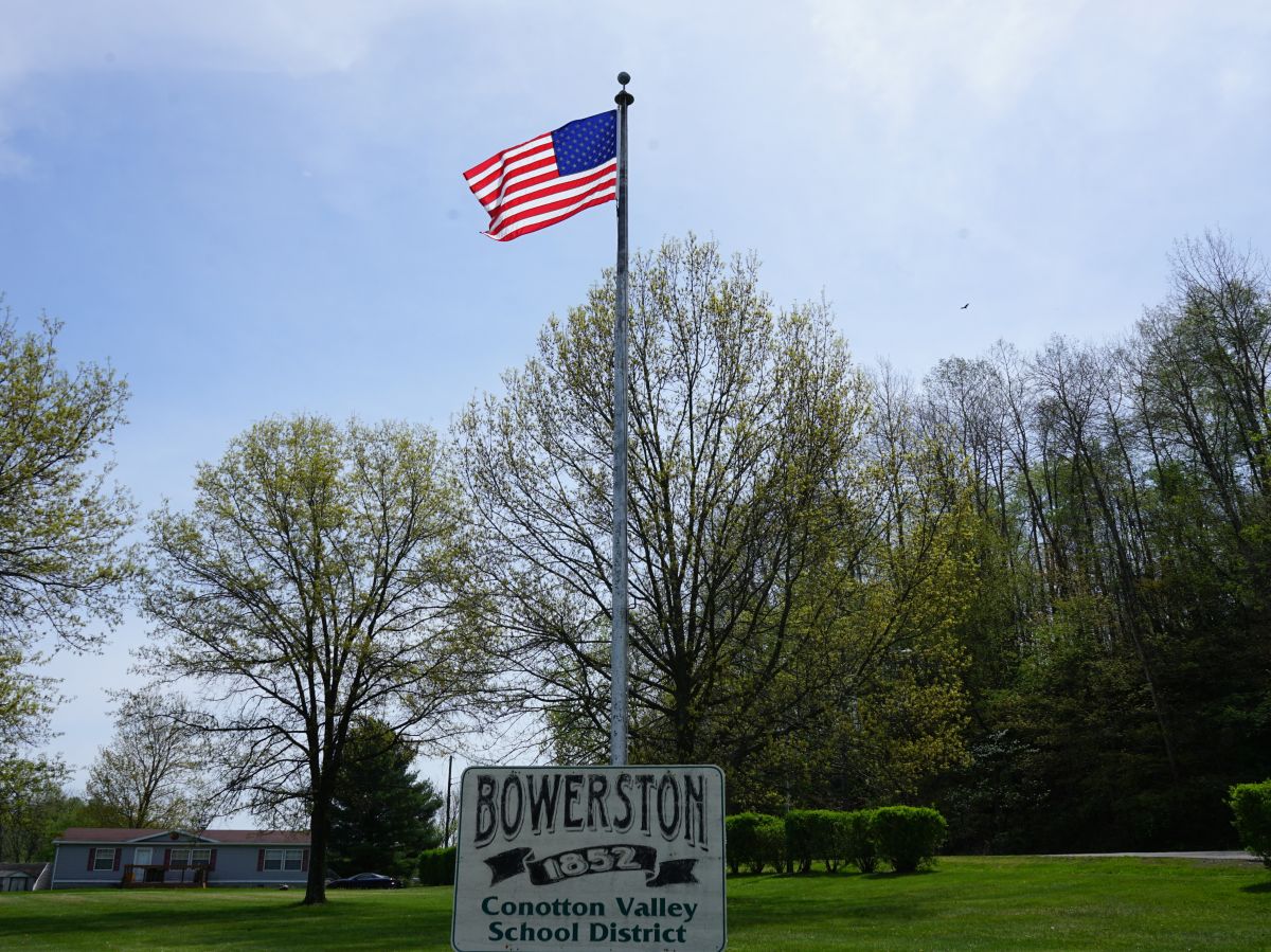 Welcome Sign and American Flag